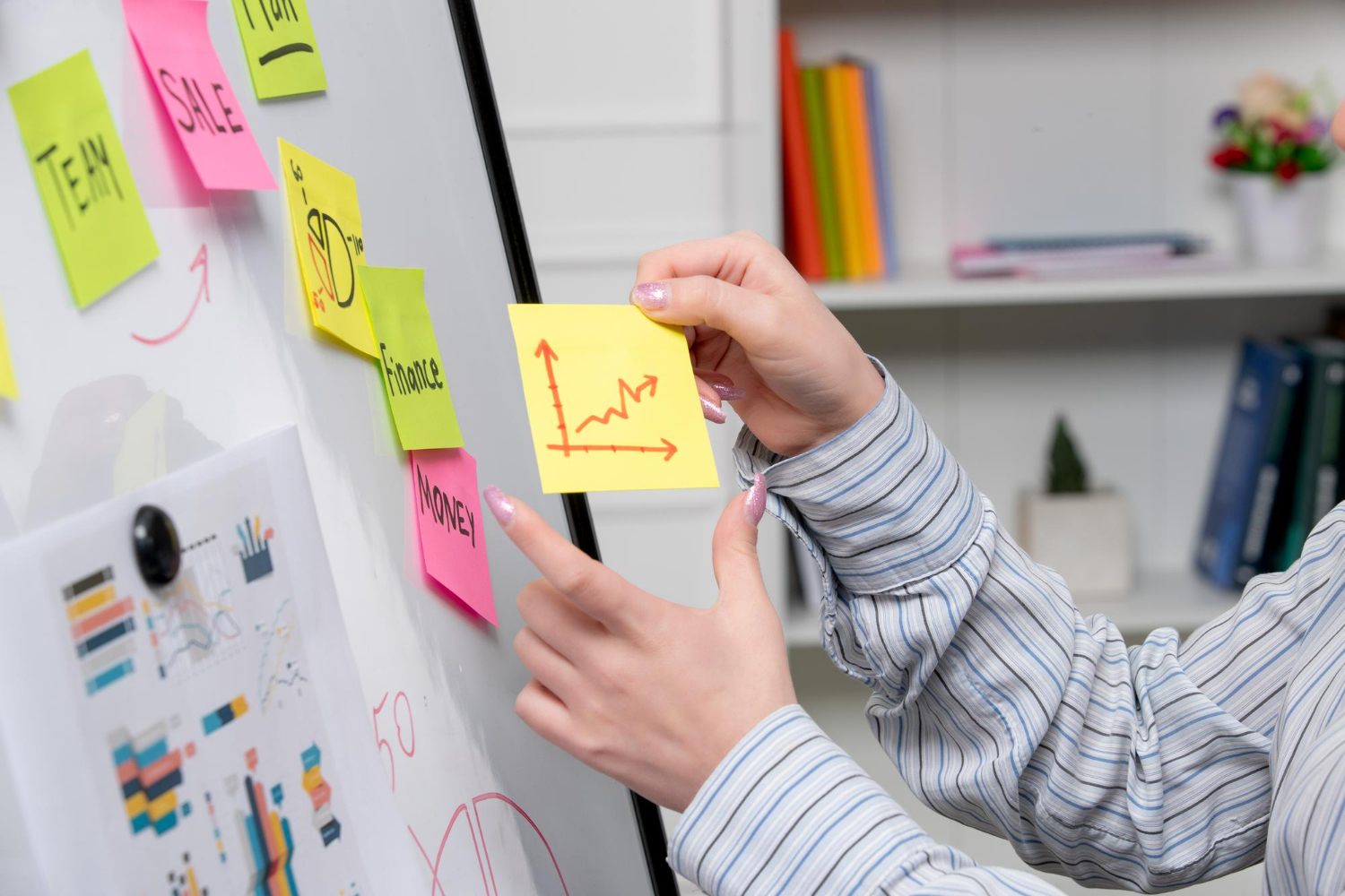 Marketing professional organising content ideas and performance notes