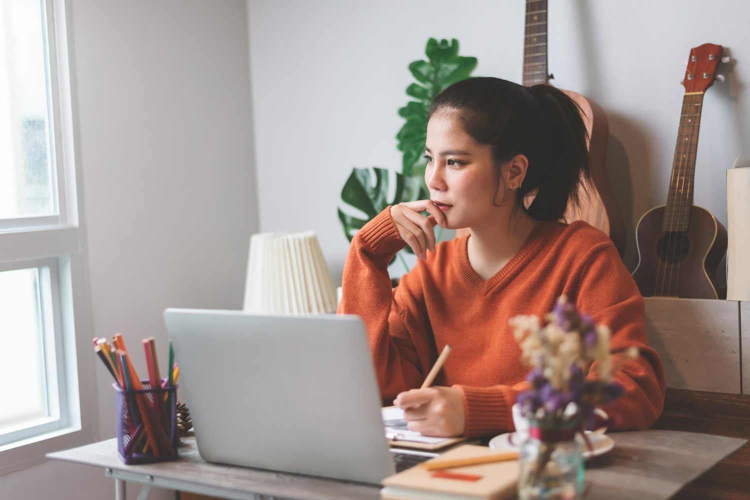 Student using a laptop for study and everyday home tasks
