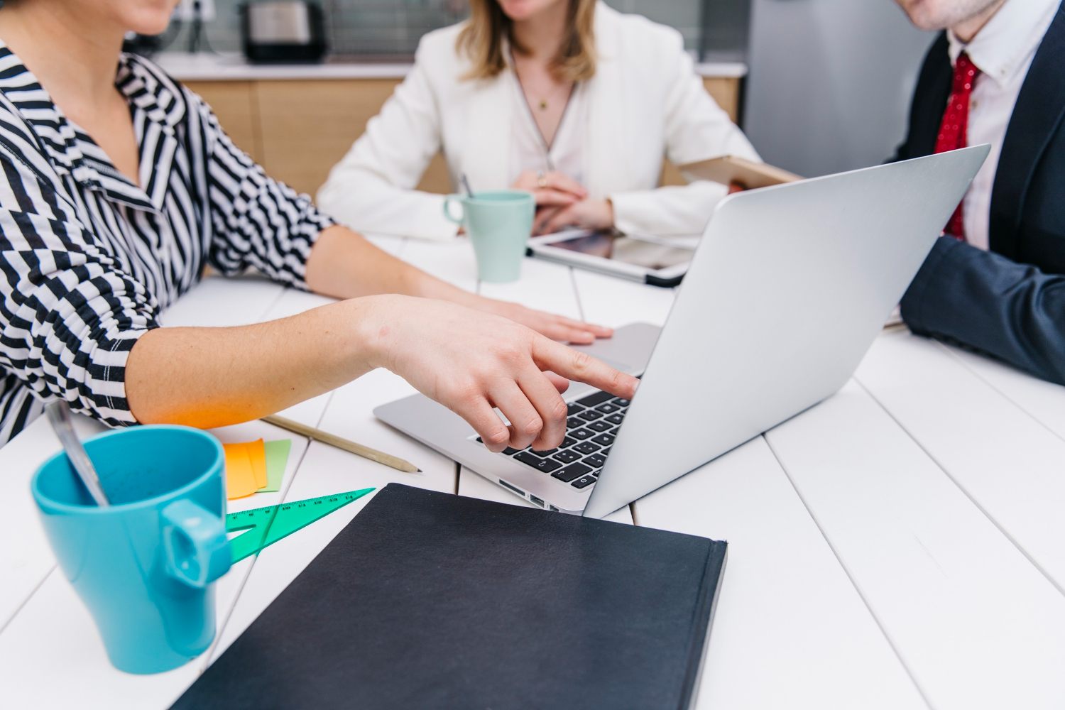 Business team using a laptop in a modern office