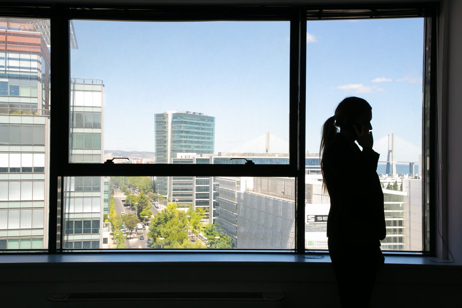 Closed city window overlooking urban buildings for road noise assessment